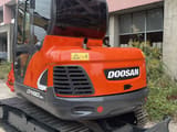 2021 Doosan DX60-9C crawler excavator, rear three-quarter view