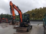 2023 Develon DX50Z-7 mini excavator, front three-quarter view