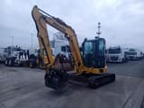 2018 Komatsu PC-55MR mini excavator, front three-quarter view