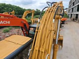 2018 Caterpillar 320C crawler excavator, close-up of boom and hydraulic lines