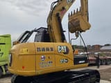 2025 Caterpillar 312 GC crawler excavator, rear three-quarter view