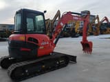 2022 Kubota U55-4 mini excavator, rear three-quarter view