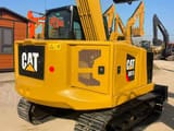 2025 Caterpillar 307.5 mini excavator rear three-quarter view