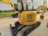 2022 Caterpillar 303.5E mini excavator rear three-quarter view