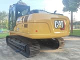 2025 Caterpillar 320GX crawler excavator rear three-quarter view