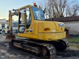 2006 Komatsu PC110 crawler excavator, rear three-quarter view
