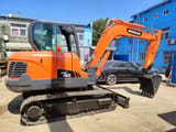 2018 Doosan DX60 crawler excavator, side view