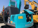 2024 Kobelco SK75 crawler excavator, rear three-quarter view