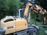 2011 Liebherr A314 wheel excavator, rear three-quarter view