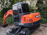 2022 Doosan DH55 Gold mini excavator, rear three-quarter view