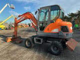 2015 Doosan DX55W mini excavator, side view