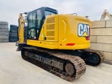 2023 Caterpillar 325 crawler excavator, rear three-quarter view