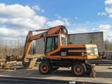 2001 Caterpillar M318 wheel excavator side view