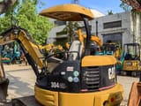 2023 Caterpillar 304CR mini excavator, rear three-quarter view