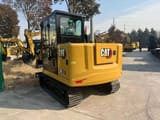 2026 Caterpillar 305.5 mini excavator rear three-quarter view