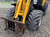 2014 Mustang AL 306 mini excavator front view with attachment