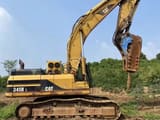 2006 Caterpillar 345B L crawler excavator side view with hydraulic breaker