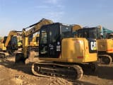 2023 Caterpillar 307E2 mini excavator, rear three-quarter view