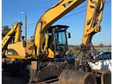 2006 Caterpillar M318CMH wheel excavator, side profile view