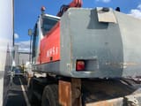 2001 O&K MH 5.5 wheel excavator, rear three-quarter view