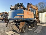 1997 Caterpillar M315 wheel excavator, rear three-quarter view