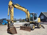 2007 New Holland MH-PLUS wheel excavator, front three-quarter view