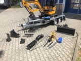 Berger Kraus BK1700JS mini excavator on trailer with attachments
