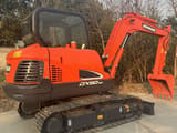 2023 Doosan DX60-9C mini excavator, rear three-quarter view