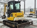 2020 Komatsu PC55MR-5 mini excavator, rear three-quarter view