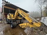 2014 Komatsu PW148-8 wheel excavator, side view