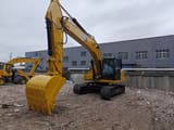 Caterpillar 320GX crawler excavator, front three-quarter view