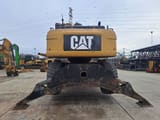 2009 Caterpillar M325D LMH material handler rear view
