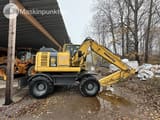 2014 Komatsu PW148-8 wheel excavator side view