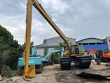 2023 Caterpillar 320BL amphibious excavator, front three-quarter view