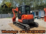 2024 Kubota KX057-4 mini excavator, front three-quarter view
