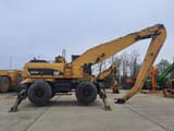 2009 Caterpillar M325D LMH material handler, side view