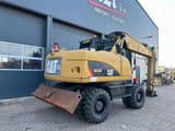 2011 Caterpillar M315D wheel excavator, rear three-quarter view