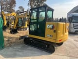 2026 Caterpillar 305.5 mini excavator, rear three-quarter view