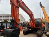 2022 Doosan DX225LC crawler excavator, front three-quarter view