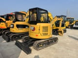 2023 Caterpillar 303.5E mini excavator, rear three-quarter view