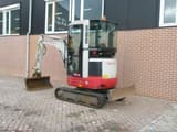 2012 Takeuchi TB23R mini excavator, front three-quarter view