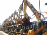 2016 Caterpillar 306D excavator, side profile view of a row of machines