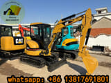 2023 Caterpillar 303CCR mini excavator, front three-quarter view