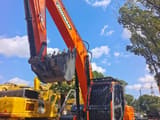 2024 Doosan DX225LC crawler excavator, front three-quarter view