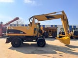 2006 Caterpillar M322C wheel excavator, side profile view