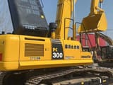 2022 Komatsu PC300-7 crawler excavator, rear three-quarter view