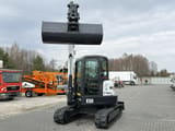 2013 Bobcat E50 mini excavator, front view with raised bucket