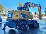 2012 Caterpillar M313D wheel excavator rear three-quarter view