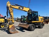 2014 Caterpillar M313D wheel excavator, side view