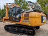 2024 Caterpillar 324DL crawler excavator, rear three-quarter view